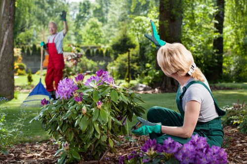 Landscaping team preparing a garden project under booking terms