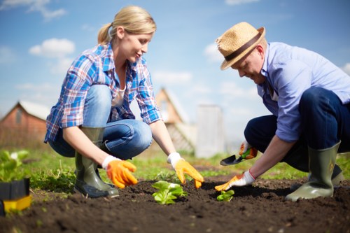 Landscaper wearing protective gear while working outdoors